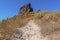 A rocky path leads up to the peak of Skaros rock on Santorini