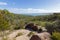 Rocky path and vegetation along trail up to Wineglass Bay lookout, View of Coles Bay, Tasmania island, Australia