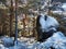 Rocky pathway next to a big boulder in Cercedilla, Sierra de Guadarrama, Spain during winter