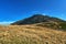 Rocky peak Sniezka on a clear autumn day