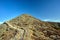 Rocky peak Sniezka on a clear autumn day in the Giant Mountains