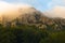 Rocky peaks at foggy sunrise, trekking path at Suva Planina mountain