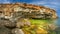 Rocky precipitous seashore, beautiful lagoon