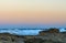 The rocky reefs and a small boat