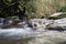 Rocky river shrouded in water for the whole frame