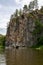 rocky riverbank. Steep high cliffs and the river