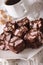 The rocky road dessert close-up on a plate and coffee. vertical