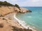 Rocky sandy beach, coastline with turquoise sea, wave splash, Spain