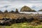 Rocky scottish shore with a distant island