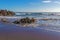 Rocky sea beach seagulls  morning sun