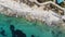 Rocky sea shore eroded by the Mediterranean turquoise sea in Sliema, Malta - Rocket aerial shot