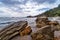 Rocky sea shore with pebble beach, waves , dramatic clouds