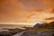 Rocky seashore at sunset