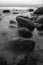 Rocky seashore in sunset black and white