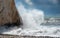 Rocky seashore with wavy ocean and waves crashing on the rocks