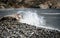 Rocky seashore with wavy ocean and waves crashing on the rocks