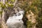 A rocky section of the Old Krasnopolyansky highway. Mountain river Mzymta.