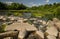 A rocky section of the Venta River on a sunny summer day, Mazeikiai, Lithuania