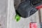 Rocky shoe on a tiny, scanty snare stands with the tip of the sock in close-up on the climbing wall in the room