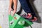 Rocky shoe on a tiny, scanty snare stands with the tip of the sock in close-up on the climbing wall in the room