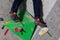 Rocky shoe on a tiny, scanty snare stands with the tip of the sock in close-up on the climbing wall in the room