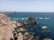 Rocky shore and the blue sea on a sunny day in Arrecife de las Sirenas, Almeria, Spain