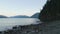 Rocky Shore with Canadian Mountain Landscape at Harrison Lake.