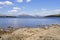 On the rocky shore of Loch Lomond on a hazy spring day