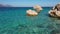 Rocky shore and sea with crystal clear blue water.