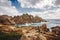 Rocky shore at Valle della Luna in Sardinia Island, Italy under a cloudy sky