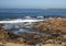 Rocky shoreline of the Atlantic Ocean near the Castle of Cheese in Porto, Portugal.