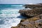 Rocky shoreline with crashing waves in aruba
