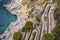 Rocky shoreline on the Tyrrhenian Sea nearby Marina Piccola, view of the footpath Via Krupp, Capri Island, Italy