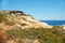 Rocky and shrubby seashore in Greece Rhodes Kalithea