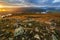 The rocky slope of the mountain against the backdrop of autumn dawn