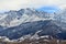 Rocky snow-capped mountains over the village of Fiagdon