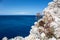Rocky steep cliff close-up on blue Ionian seascape