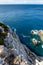 Rocky steep cliff look down, blue Ionian seascape