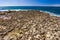 Rocky stone shore, clear turquoise sea water and blue sky clear day