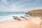 Rocky and stony cliffs and sandy beach is known as Alteirinhos Beach near Zambujeira do Mar, Odemira region, western Portugal.