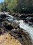 Rocky Stream Through the Mountains