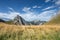 Rocky summit of tyrol mountain with dry meadow