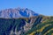 Rocky towny in autumn mountains. Rocky mountain peak with autumn