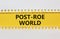 Roe vs Wade post-Roe world symbol. Concept words Post-Roe world on yellow paper on a beautiful white background. Business and Roe