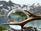 Roebuck antlers next to lensball, crystal ball, with reflections of Lake Lunersee (Lünersee, Montafon, Vorarlberg).