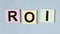 ROI acronym, return of investment word on sticky notes