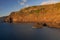 Rojas volcanic rocks cliff, with golden hour sunset sunlight