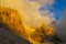 Roky cliff mountains of Dolomites yellow color at sunset