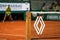 Roland Garros tennis net with premium sponsor`s Renault French multinational automobile manufacturer logo as seen during match