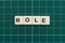 Role word made of square letter word on green square mat background